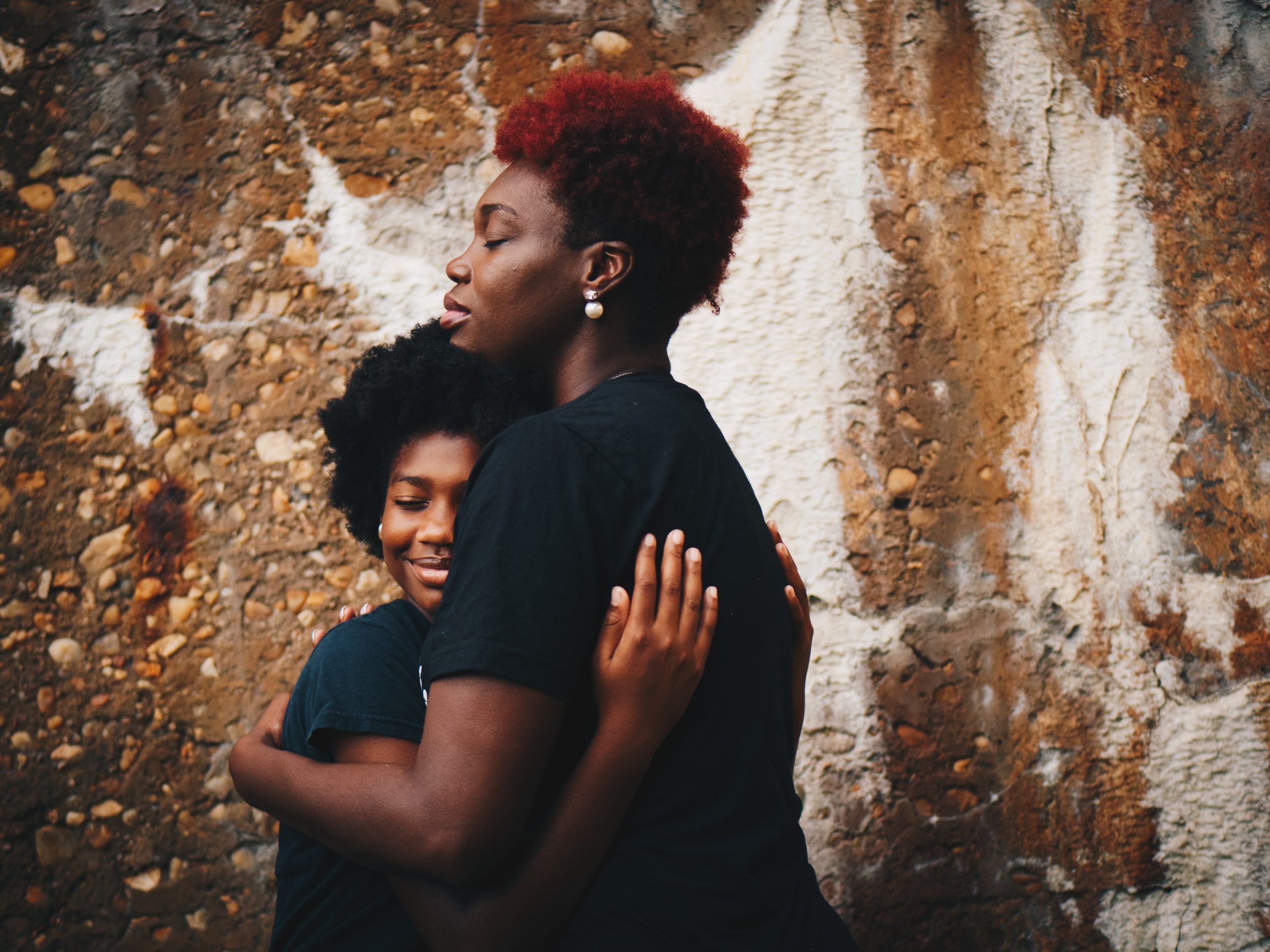 Photo of mother and daughter by Eye For Ebony on Unsplash