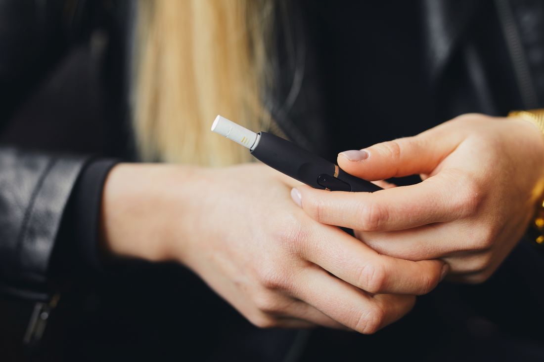 Girl holding ecigarette in case